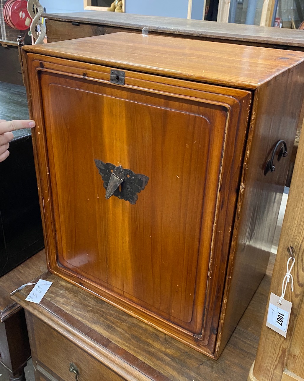 A Chinese pine cabinet housing an arrangement of eight drawers, width 48cm height 56cm